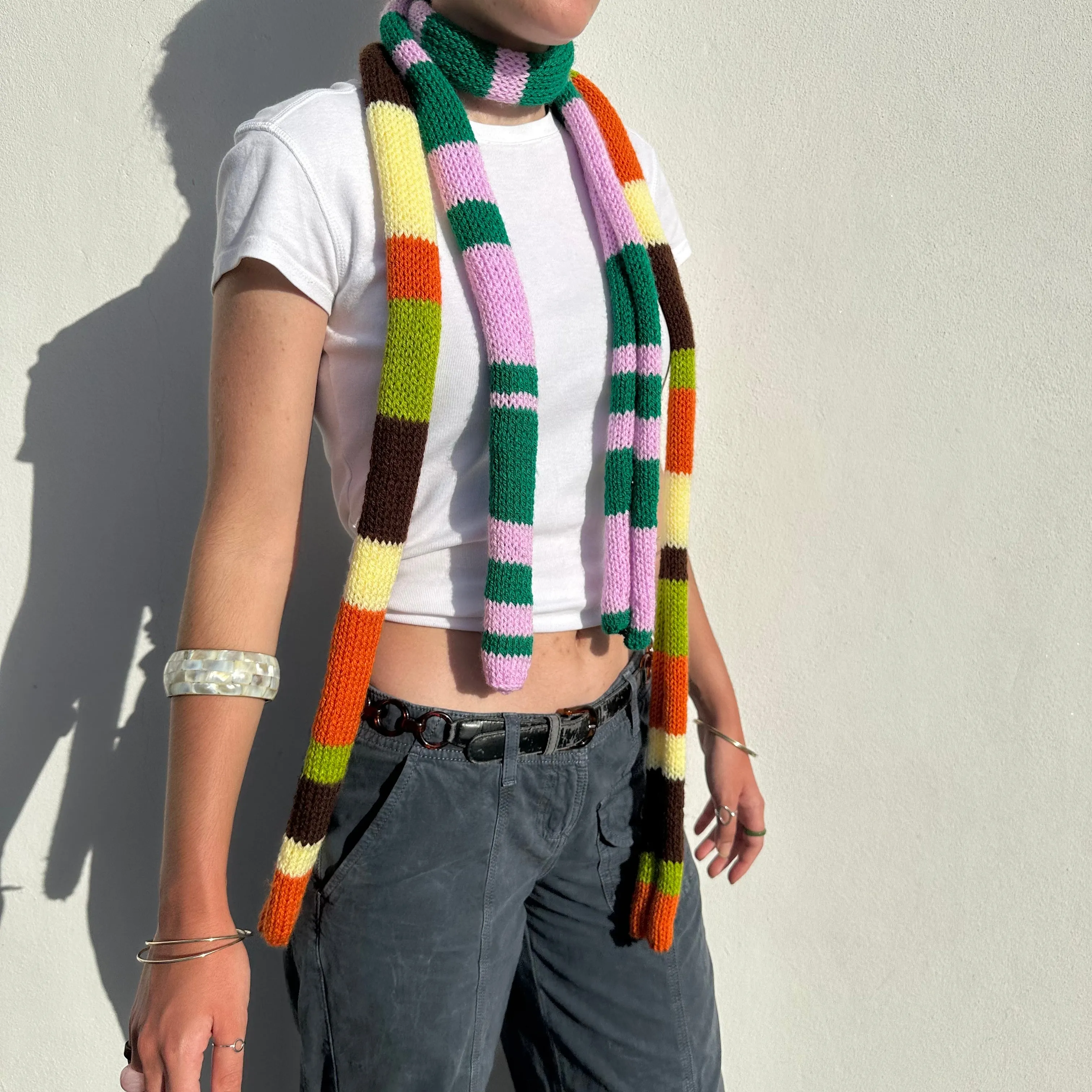 Handmade knitted stripy skinny scarf in baby pink and green